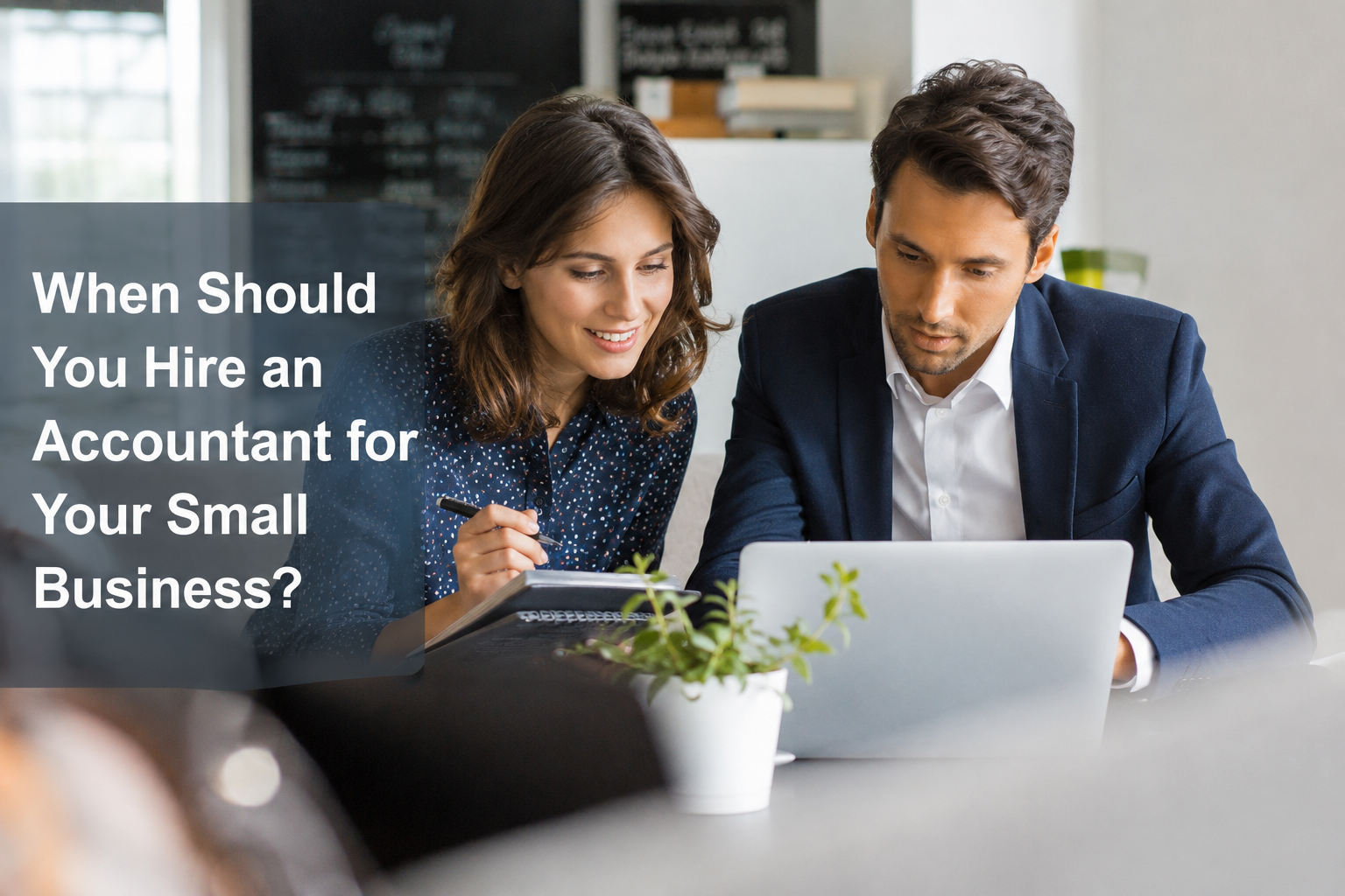 Small business owner reviewing accounts with an accountant to decide when to get professional accounting support.
